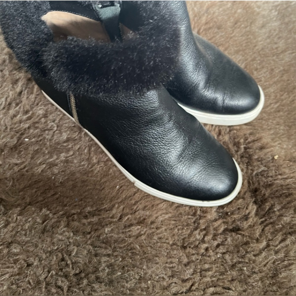 Paolo leather Black sneaker bootie with faux fur trim.
